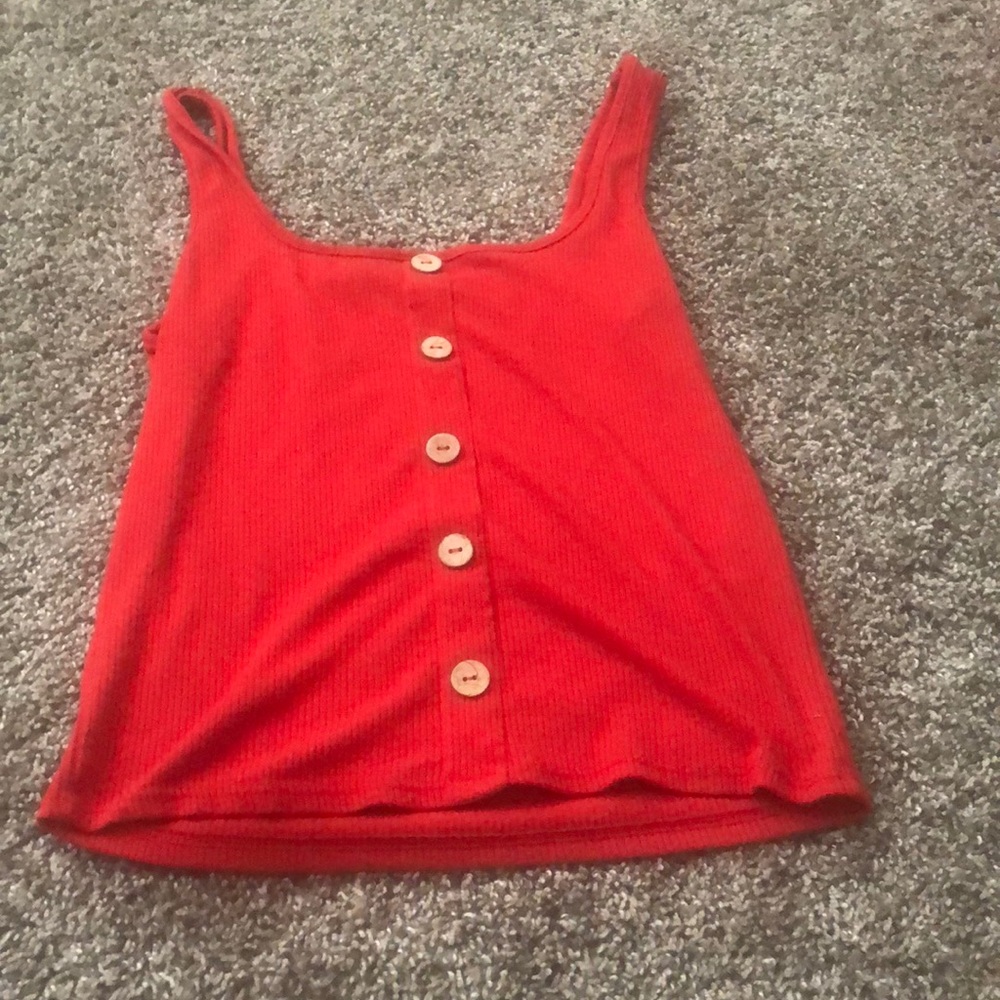 A red button shirt